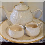 P28. Lenox Acanthus Leaf Cottage collection teapot with platter and cream and sugar. Sugar bowl is chipped and missing top. Platter measures 13” - $50 
